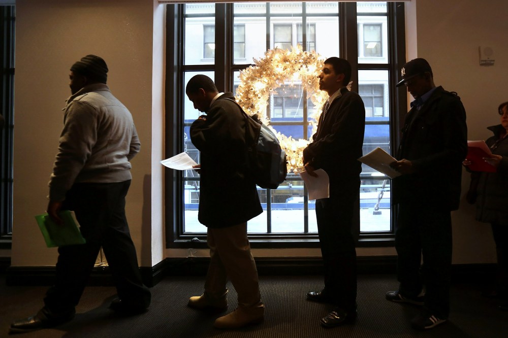 Applicants line up to meet potential employers at the Diversity Job Fair, Dec. 6, 2012, in New York, N.Y.