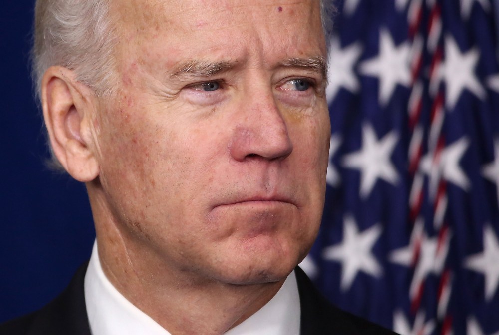 Vice President Biden listens as President Obama speaks during an announcement on gun reform in the Brady Press Briefing Room of the White House December 19, 2012 in Washington, DC. (Photo by Win McNamee/Getty Images)