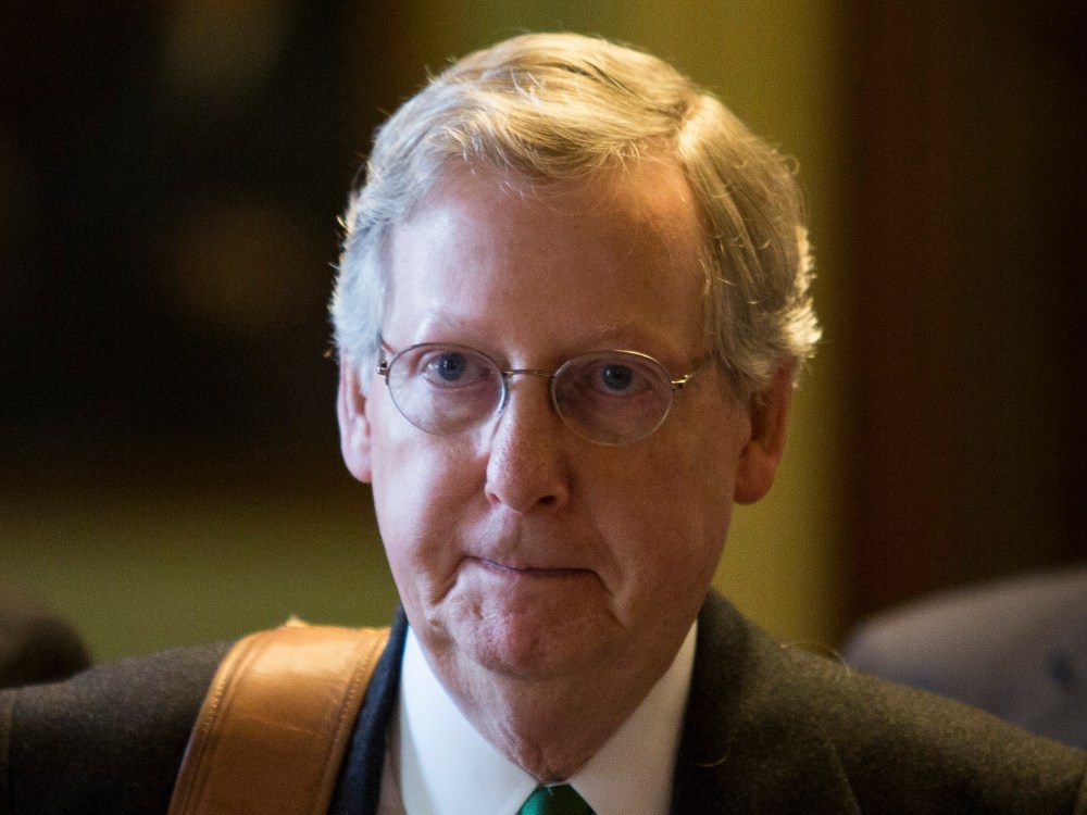 File Photo: Senate Minority Leader Mitch McConnell (R-KY) walks to his office on Capitol Hill December 31, 2012 in Washington, DC. The House and Senate are both still in session on New Year's Eve to try to deal with the looming 'fiscal cliff.' (Photo...