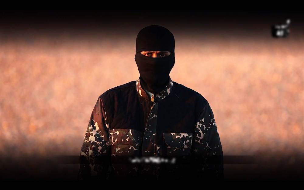 A screengrab of the ISIS propaganda video featuring a masked man with what sounded like a British accent. (Photo by Flashpoint)