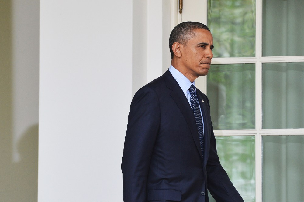 US President Barack Obama is followed by Vice President Joe Biden as they walk out of the Oval Office to speak on gun control at the Rose Garden of the White House in Washington, DC, on April 17, 2013.