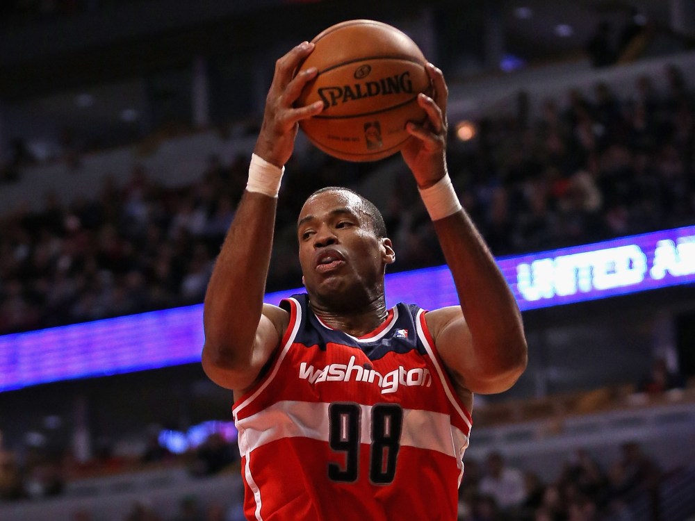 Jason Collins #98 of the Washington Wizards rebounds against the Chicago Bulls at the United Center on April 17, 2013 in Chicago, Illinois. (Photo by Jonathan Daniel/Getty Images)