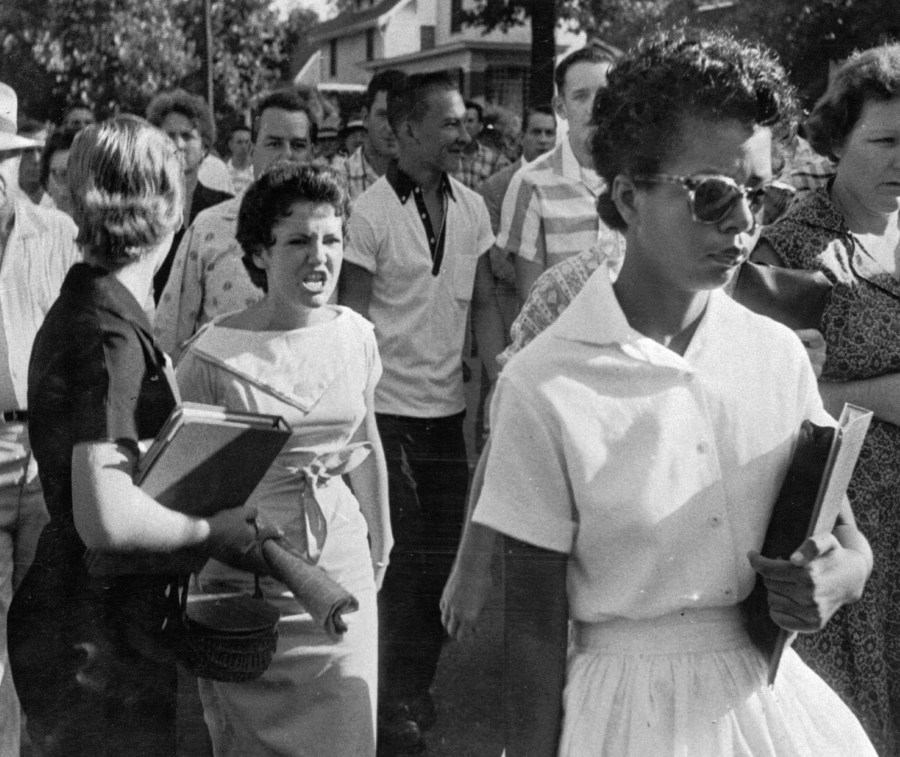 Students of Central High School in Little Rock, Ark., shout insults at Elizabeth Eckford as she calmly walks toward a line of National Guardsmen on Sept. 4, 1957.