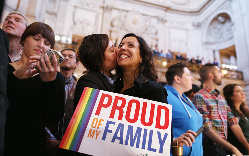 A couple celebrates upon hearing the U.S. Supreme Court's rulings on gay marriage in San Francisco on June 26, 2013.  (Photo by Justin Sullivan/Getty Images)