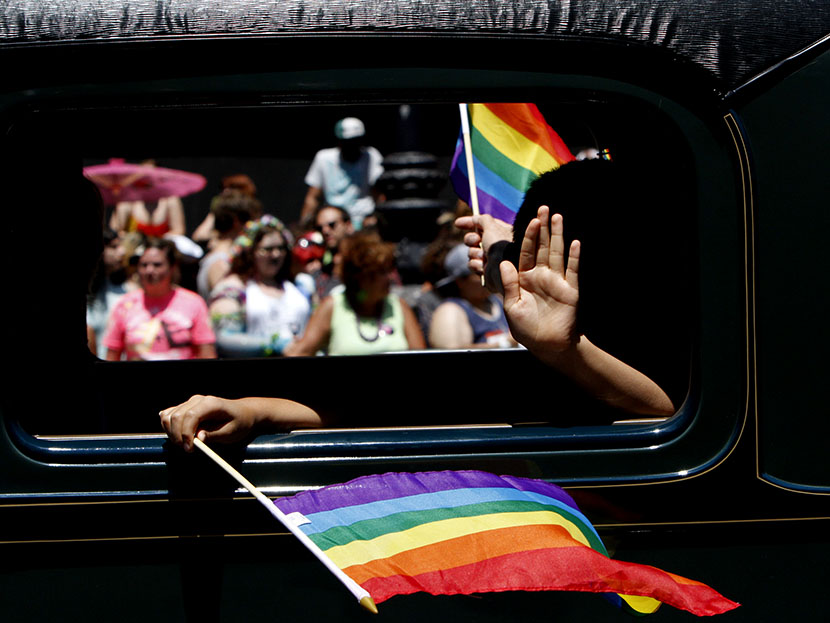 One of the historic cars makes its way down Market St. during the 43rd annual San Francisco Lesbian, Gay, Bisexual, Transgender (LGBT) Pride Celebration & Parade June 30, 2013, in San Francisco, California. (Photo by Sarah Rice/Getty Images)