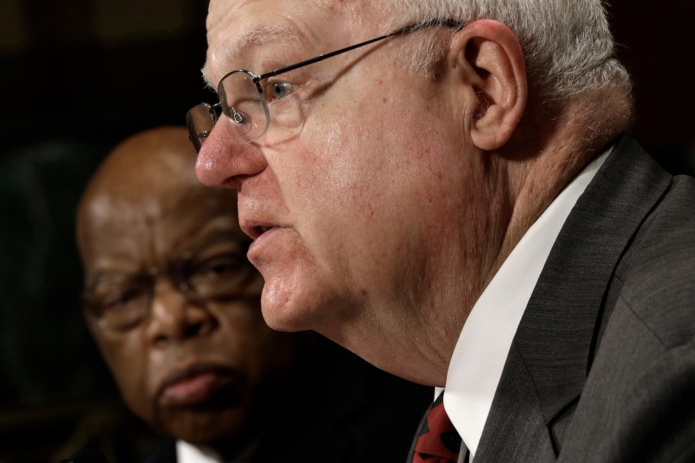Rep John Lewis (D-GA) (L) listens as Rep. Jim Sensenbrenner (R-WI) testifies before the Senate Judiciary Committee on July 17, 2013 in Washington, DC.