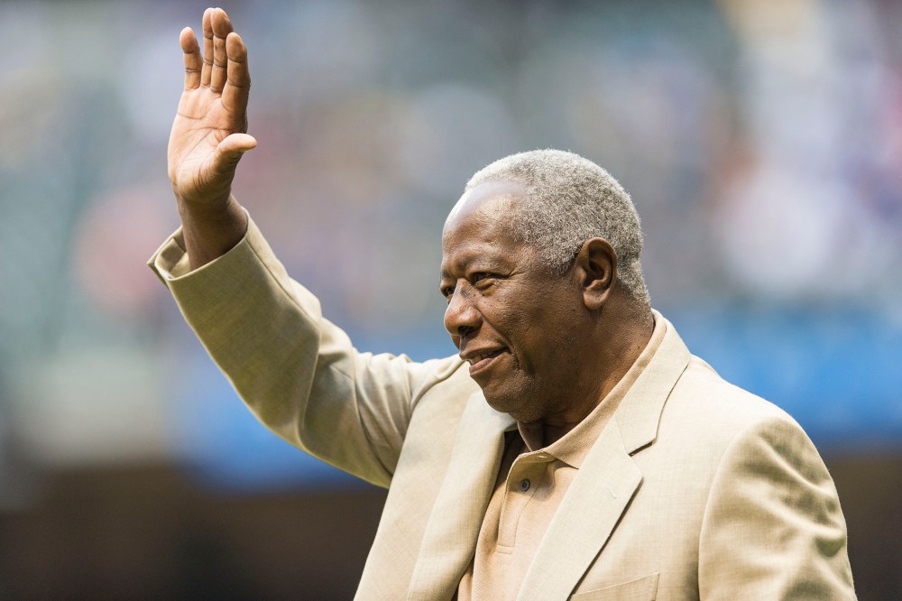 Baseball Hall of Famer Hank Aaron waves to the crowd before the start of the Washington Nationals game at Miller Park on Aug. 2, 2013 in Milwaukee, Wisc.