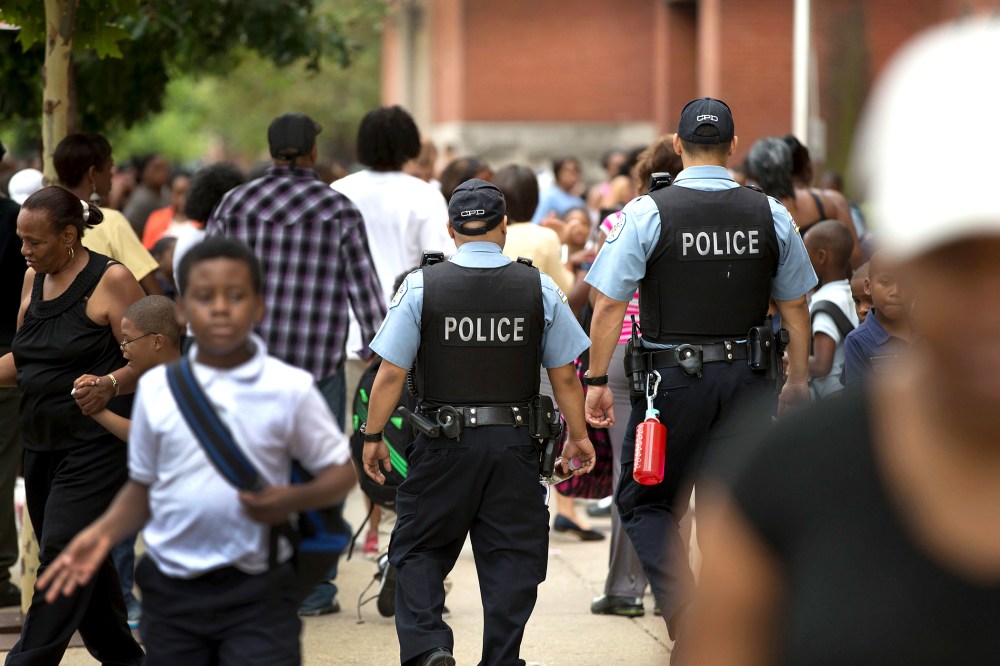 Chicago Police And Neighborhood Officials Escort Children To School
