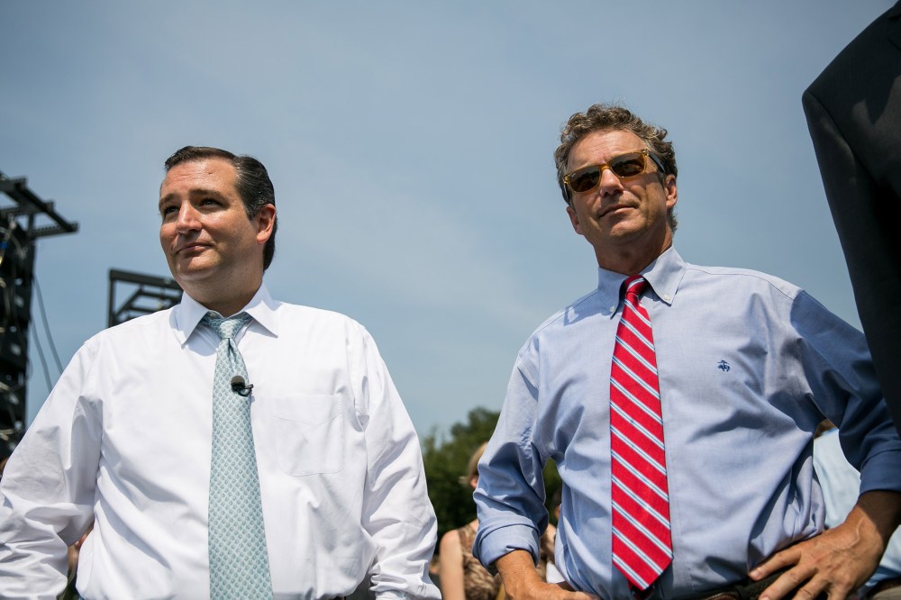 U.S. Sen. Ted Cruz (R-TX) (L) and Sen. Rand Paul (R-KY) wait to speak at an event on Sept. 10, 2013 in Washington, DC.