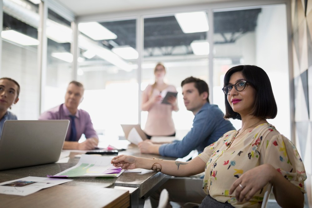 Image: Smiling businesswoman in meeting conference room