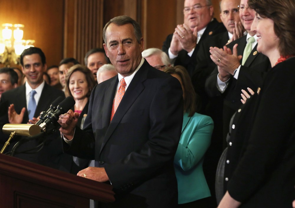 Speaker of the House Rep. John Boehner (R-OH) celebrates as he speaks during a rally as other House Republicans look on after a vote September 20, 2013 on Capitol Hill in Washington, D.C.
