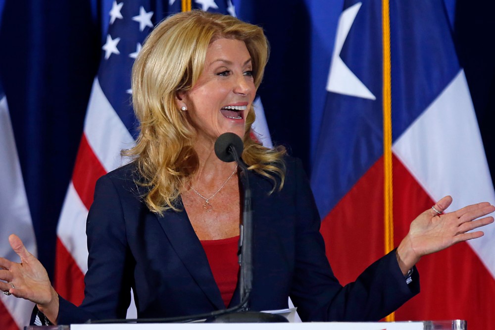 Texas State Sen. Wendy Davis speaks at the podium at the W.G. Thomas Coliseum in Haltom City on October 3, 2013 in Haltom City, Texas.