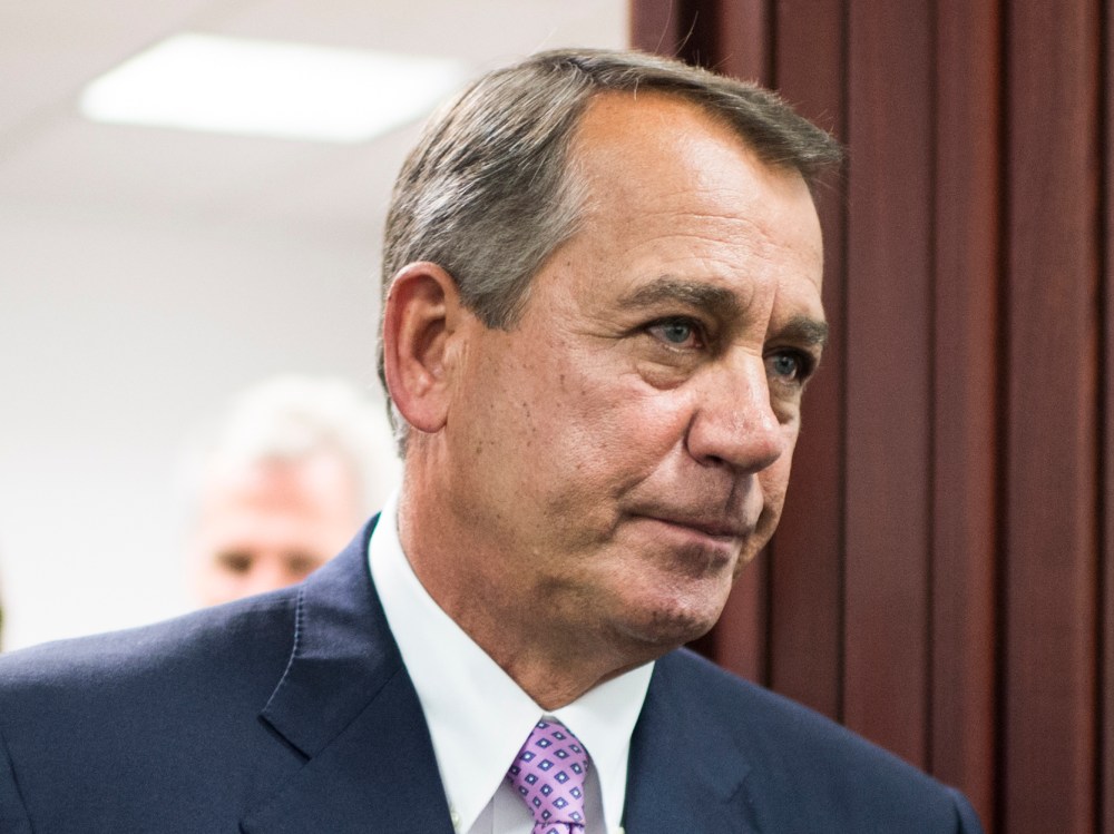 Speaker of the House John Boehner leaves the House Republican Conference meeting in the basement of the Capitol to speak to the media on Friday, Oct. 4, 2013.