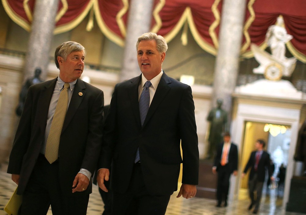Majority Whip Kevin McCarthy (R-CA) (R) and Rep. Fred Upton R-MI) walk through Statuary Hall at the U.S. Capitol on Oct. 9, 2013 in Washington, DC.