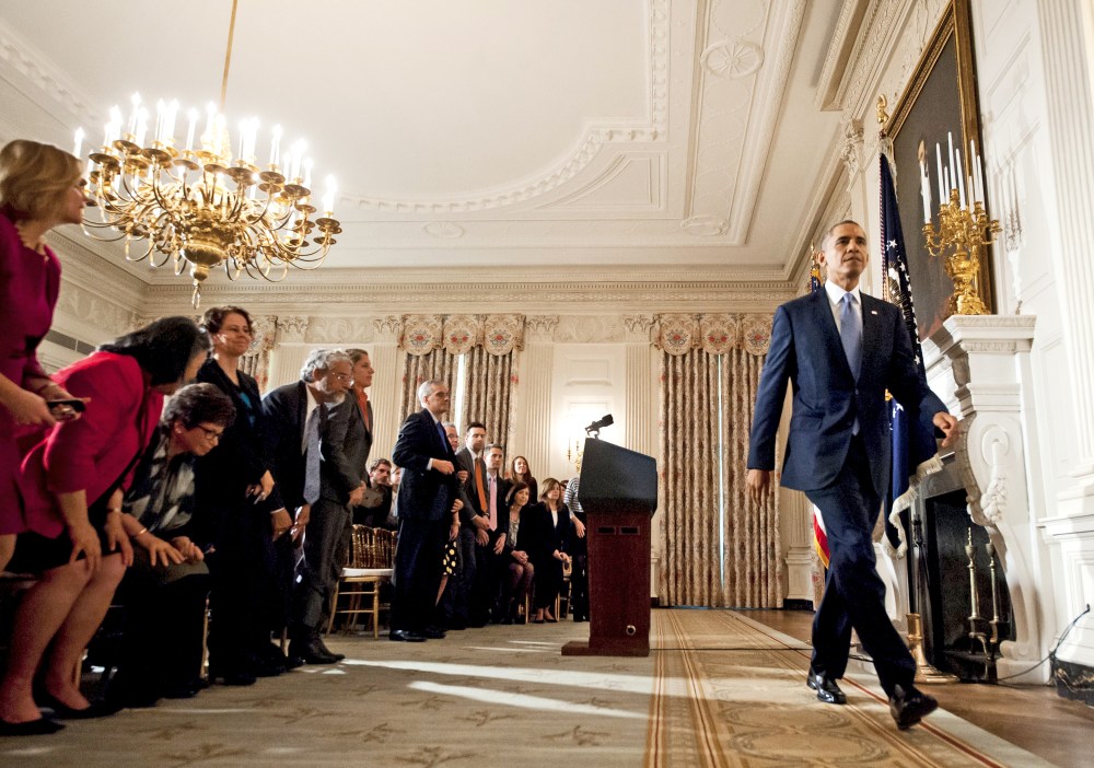 US President Barack Obama leaves after speaking about the reopening of government following a shutdown in the State Dining Room of the White House in Washington, DC, October 17, 2013.