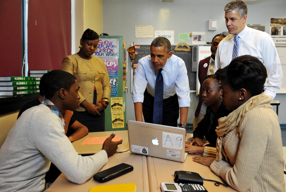 US President Barack Obama chats with students during a visit to a classroom at Pathways in Technology Early College High School, in Brooklyn, New York on October 25, 2013.