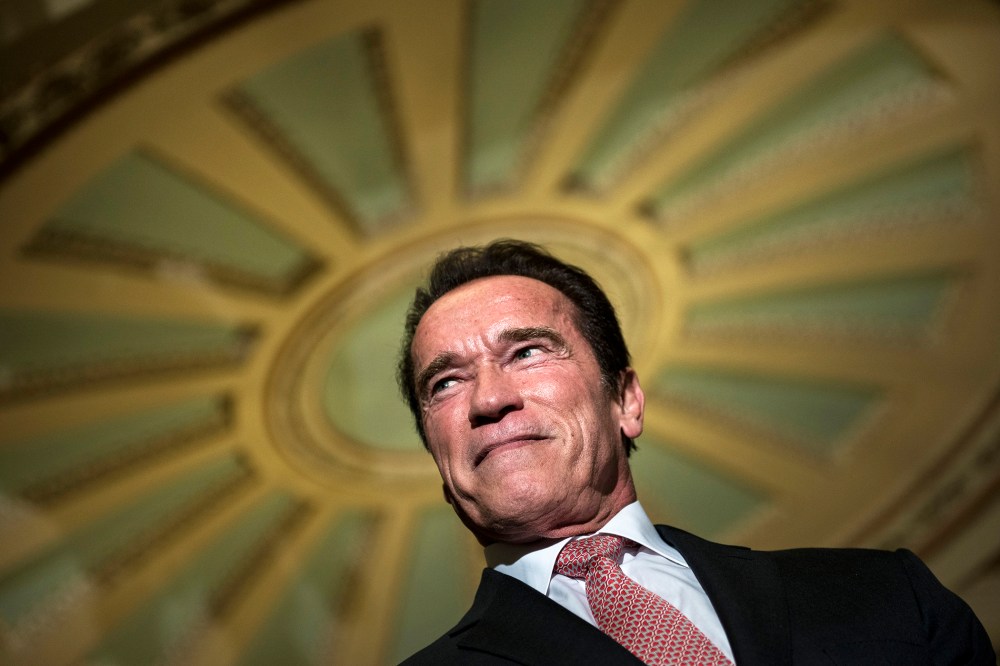 Actor and former California governor Arnold Schwarzenegger listens to questions from the press on Capitol Hill on Oct. 30, 2013 in Washington, D.C. (Photo by Brendan Smialowski/AFP/Getty)