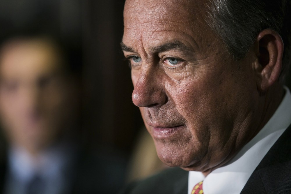 Speaker John Boehner speaks to the press after a Republican conference meeting on November 13, 2013 in Washington, D.C.