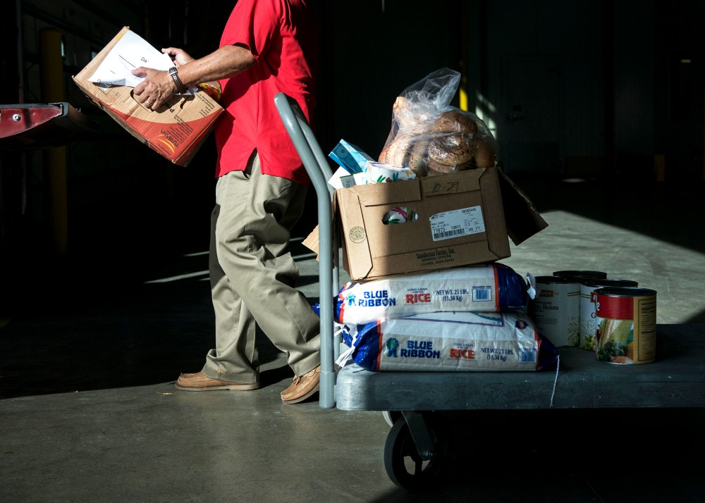 A volunteer loads food at the Capital Area Food Bank, Nov. 14, 2013 in Washington, DC.
