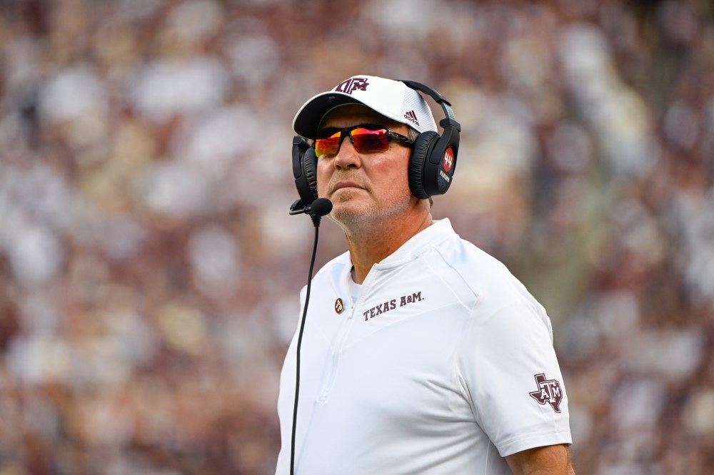 Texas A&M Aggies head coach Jimbo Fisher watches a replay during the football game
