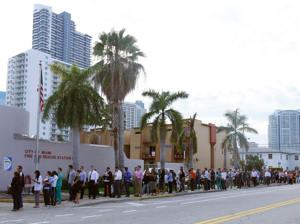 People wait in line to vote at a fire station near downtown, during the U.S. presidential election in Miami, Florida November 6, 2012. (Photo by REUTERS/Andrew Innerarity)