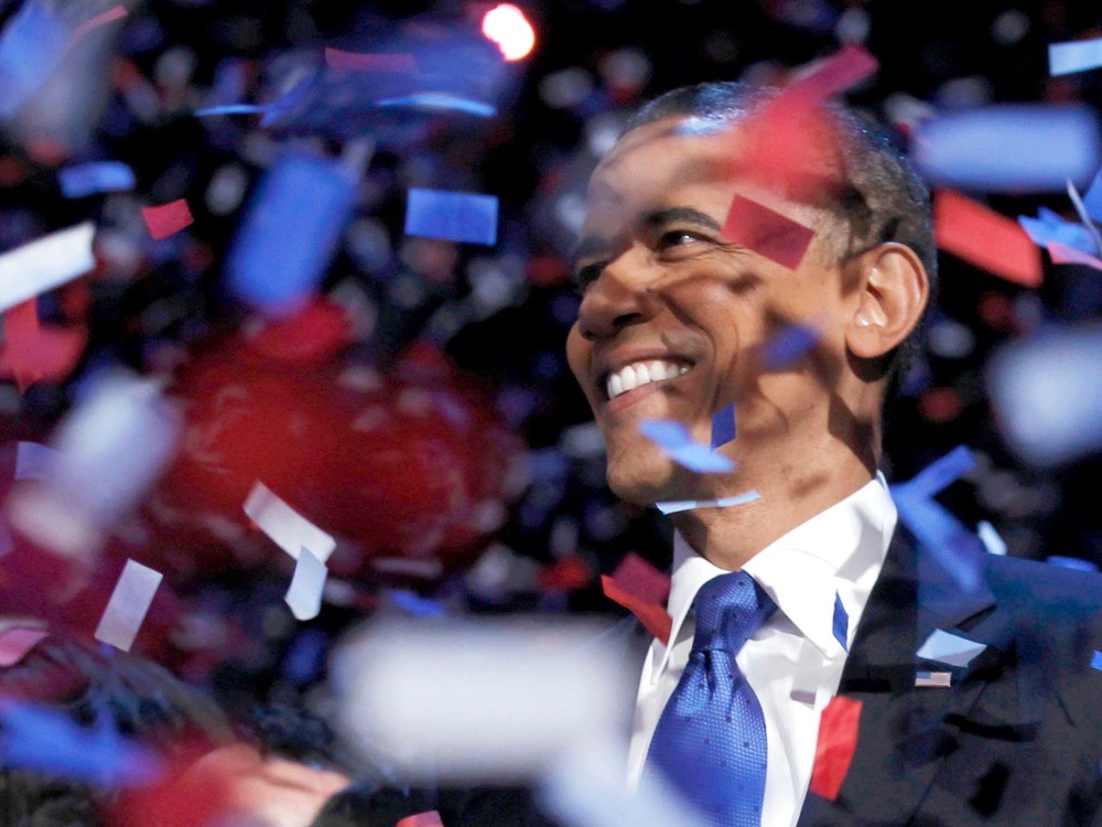 U.S. President Barack Obama celebrates on stage as confetti falls after his victory speech during his election rally in Chicago, November 6, 2012. (Photo by REUTERS/Kevin Lamarque)