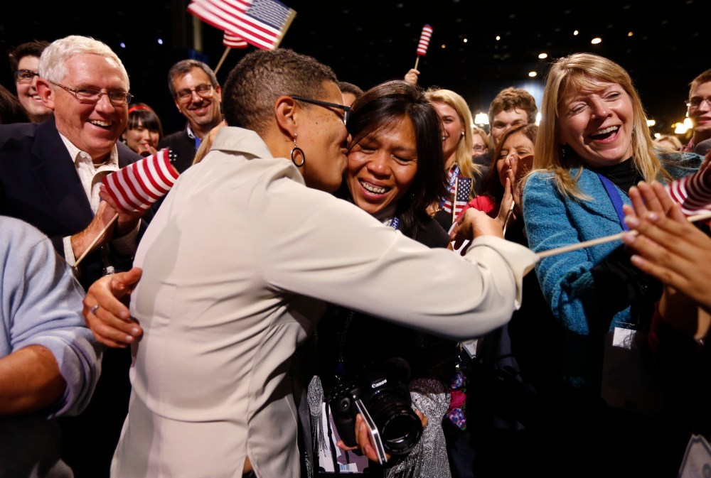 Keesha Patterson of Ft. Washington, Maryland (L) kisses her girlfriend Rowan Ha (R) after proposing marriage, during the election night victory rally at re-elected President Barack Obama headquarters in Chicago. (Photo: REUTERS/Kevin Lamarque)