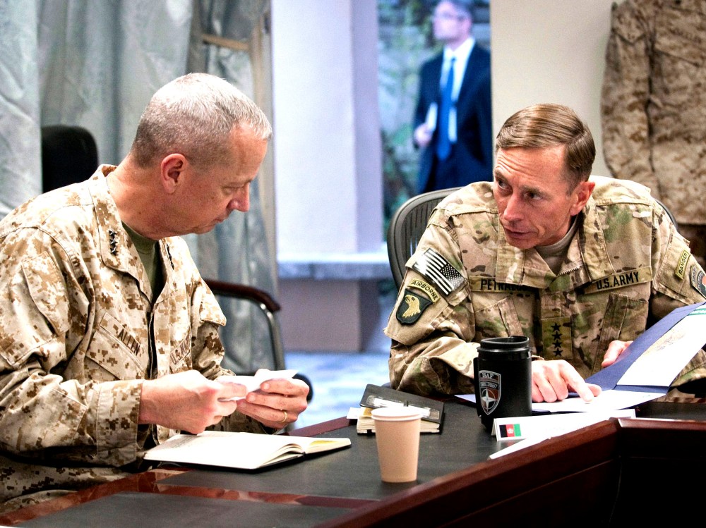 File Photo: General John R. Allen (L), incoming commander, International Security Assistance Force (ISAF)/U.S. Forces- Afghanistan (USFOR-A) and General David H. Petraeus, commander, ISAF/USFOR-A, attend a meeting in Kabul, Afghanistan in this July 9,...