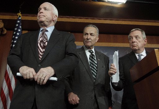 (R-L) U.S. Senator Richard Durbin (D-IL), Senator Charles Schumer (D-NY) and Senator John McCain (R-AZ) listen to a question at a news conference on comprehensive immigration reform at the U.S. Capitol in Washington January 28, 2013. (REUTERS/Gary...