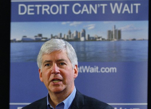 Michigan Governor Rick Snyder talks about the city of Detroit being in a financial emergency state during a  meeting with an invited audience at Wayne State University in Detroit, Michigan March 1, 2013.   (REUTERS/ Rebecca Cook)
