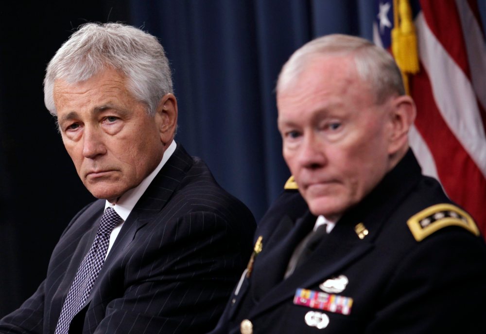 U.S. Secretary of Defense Chuck Hagel (L) and Joint Chiefs of Staff General Martin Dempsey hold a joint news conference at the Pentagon in Washington March 17, 2013. (Photo by Yuri Gripas/Reuters)