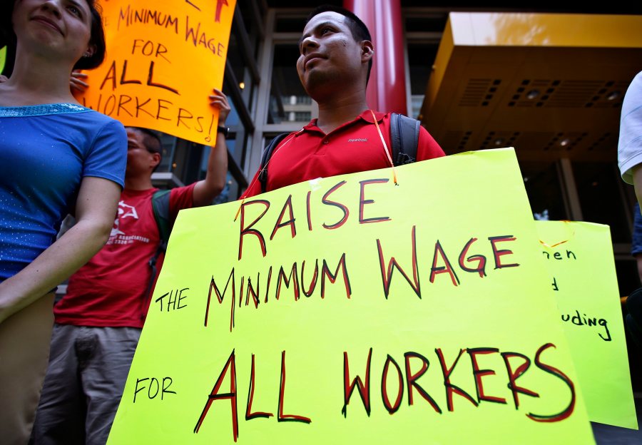 Low wage workers take part in a protest organized by the Coalition for a Real Minimum Wage outside the offices of New York Governor Andrew Cuomo, May 30, 2013. (REUTERS/Mike Segar)