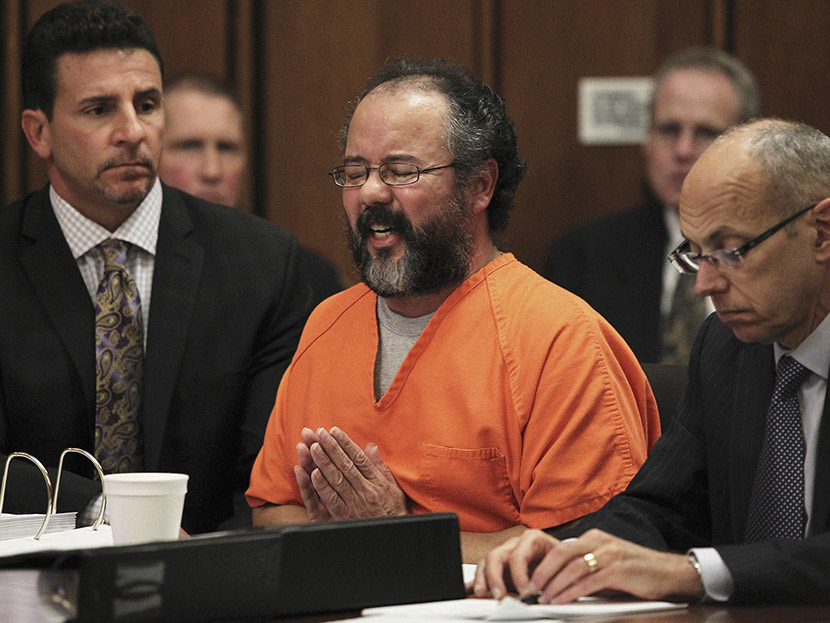 Ariel Castro (C), 53, breaks down while talking about the child that he fathered with Amada Berry as he addresses the court while seated between attorneys Craig Weintraub (L) and Jaye Schlachet in the courtroom in Cleveland, Ohio August 1, 2013. ...