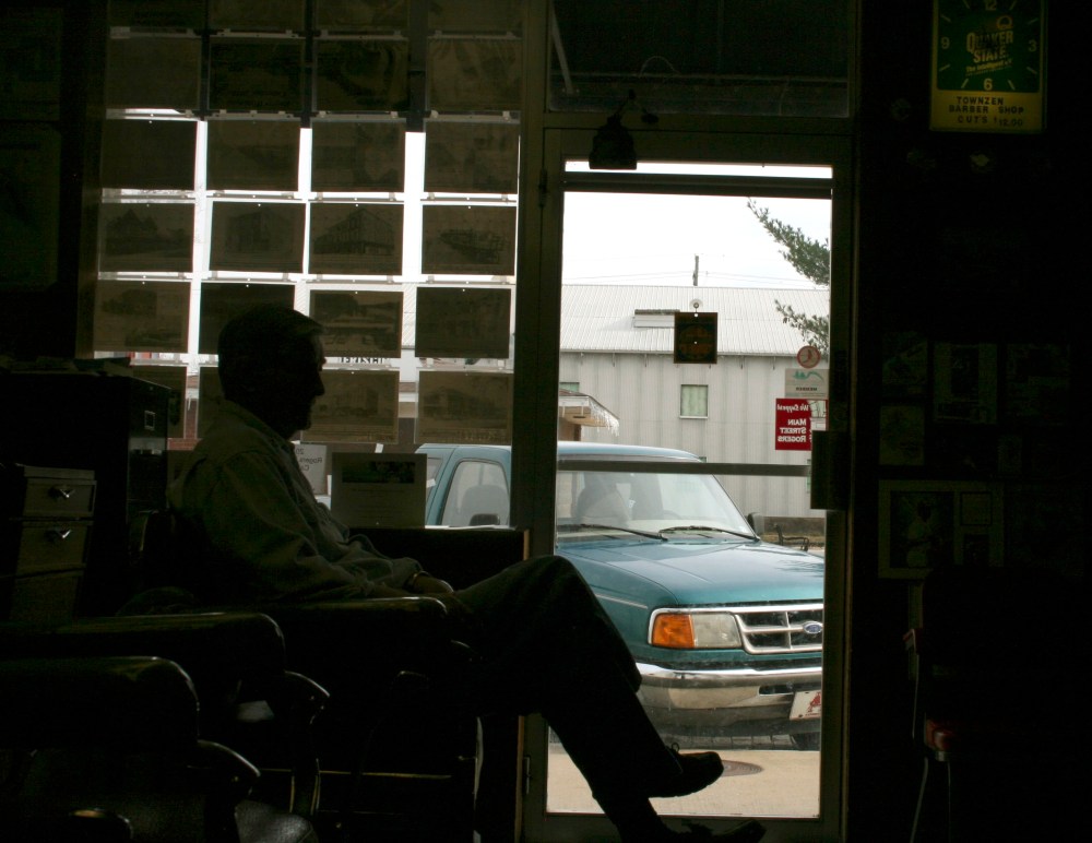 Ray Sanford awaits a haircut in a barbershop in downtown Rogers, Arkansas, December 4, 2013.
