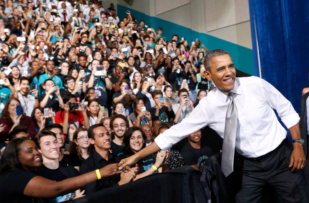 President Barack Obama is greeted by students at the Coral Reef High School in Miami, Florida, March 7, 2014.