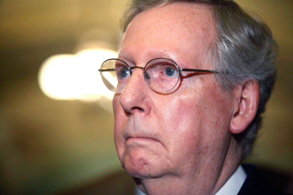 U.S. Senate Minority Leader Mitch McConnell (R-KY) answers questions from reporters after the weekly Republican caucus luncheon at the U.S. Capitol in Washington March 11, 2014.