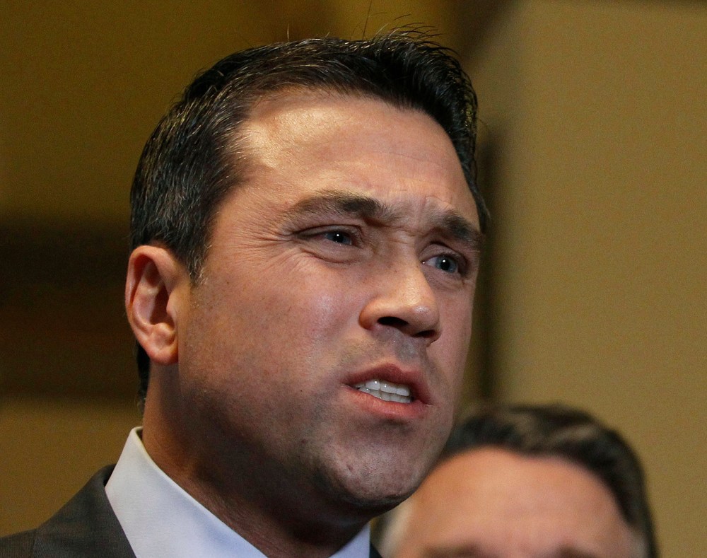 U.S. Representative Michael Grimm (R-NY) talks to the media after a meeting at the U. S. Capitol in Washington, in this  January 2, 2013 file photo.
