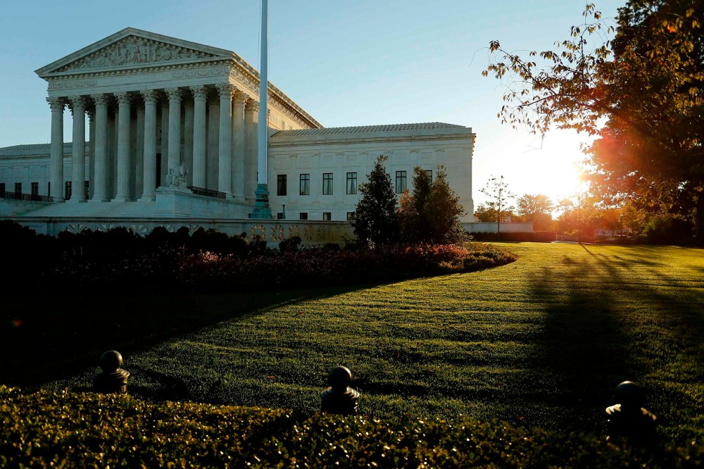 A general view of the U.S. Supreme Court building at sunrise is seen in Washington on Oct. 5, 2014.