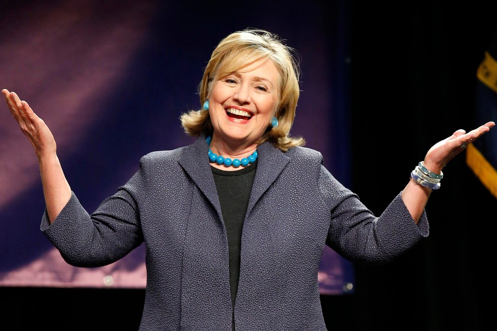 Former U.S. Secretary of State Hillary Clinton reacts as she is introduced before speaking at a campaign event in Charlotte, N.C. on Oct. 25, 2014.