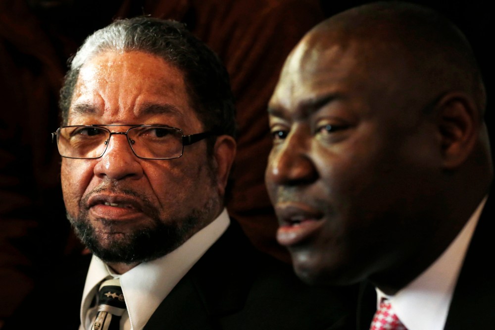 Howard Morgan (L) listens to his attorney Benjamin Crump at a news conference to discuss his release from prison in Chicago, Illinois, on Jan. 16, 2015. (Photo by Jim Young/Reuters)