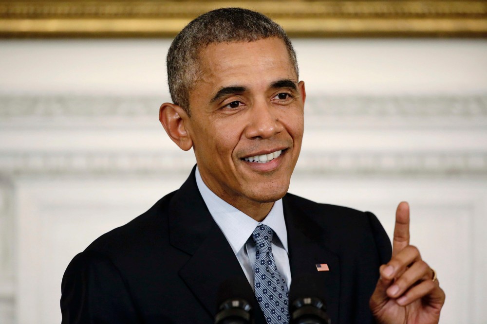 U.S. President Barack Obama gestures while addressing a news conference in the State Dining Room at the White House in Washington, Oct. 2, 2015. (Photo by Joshua Roberts/Reuters)