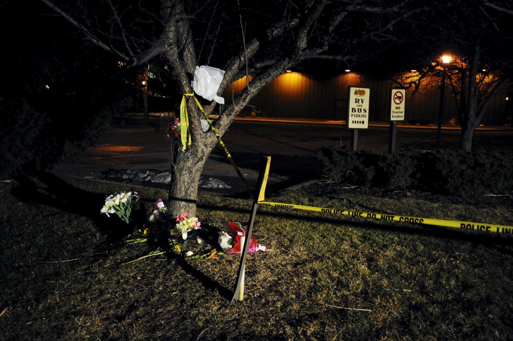 Flowers are placed at a makeshift memorial near a Cracker Barrel restaurant, one of the sites of a series of random shootings that killed six people in Kalamazoo County, Mich., on Feb. 21, 2016. (Photo by Mark Kauzlarich/Reuters)