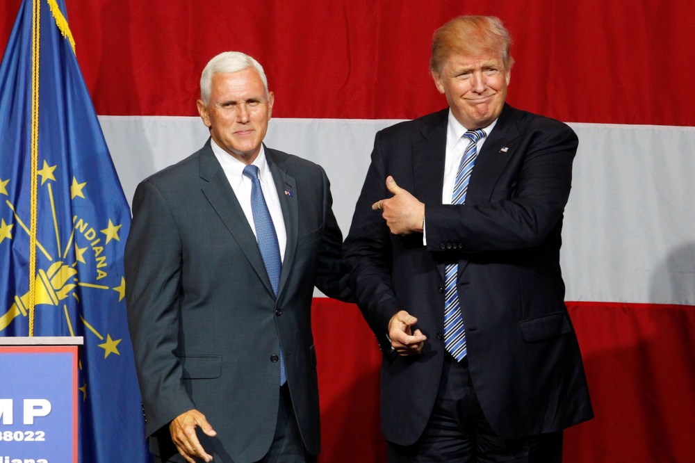 Republican presidential candidate Donald Trump and Indiana Governor Mike Pence wave to the crowd before addressing the crowd during a campaign stop at the Grand Park Events Center in Westfield, Indiana, July 12, 2016. (Photo by John Sommers II/Reuters)