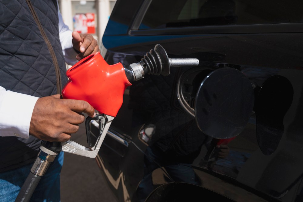 A man pumps gas at an Exxon station in Washington on Tuesday, March 8.