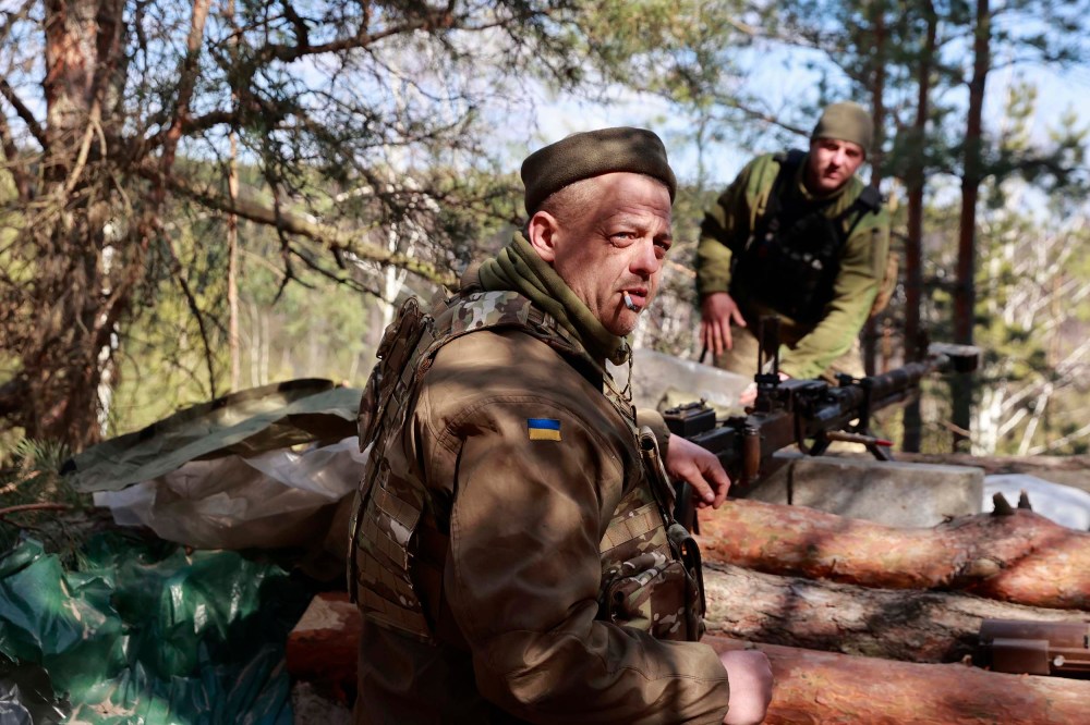 Ukrainian servicemen guard their position near Brovary, north of Kyiv, Ukraine, Thursday, March 17.