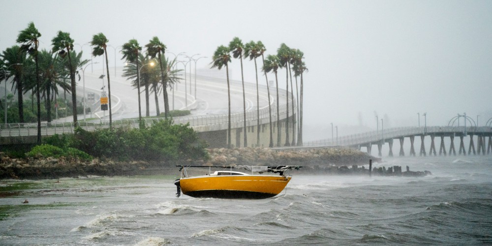Image: A sail boat is beached at Sarasota Bay as Hurricane Ian approaches Florida.