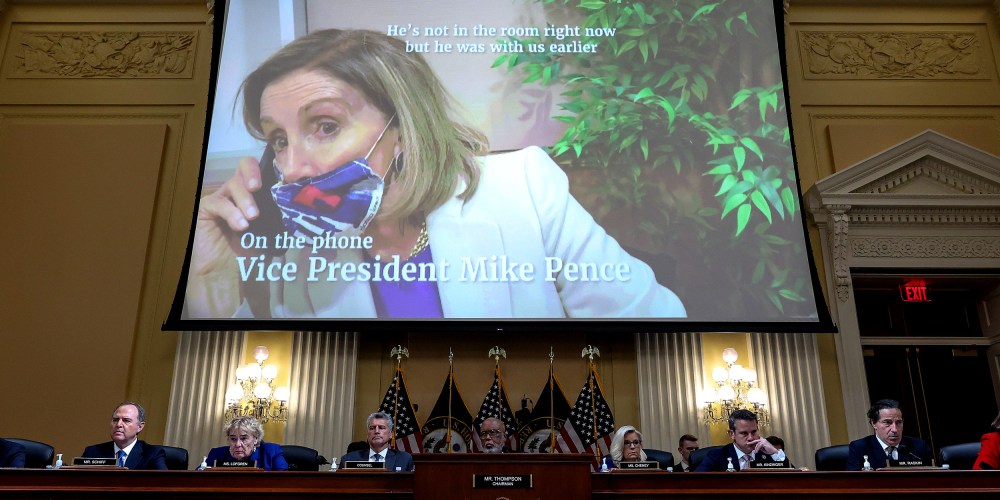 Image: A screen shows Speaker of the House Nancy Pelosi on the phone with Vice President Mike Pence as the House Select Committee to Investigate the January 6th Attack on the U.S. Capitol listens.
