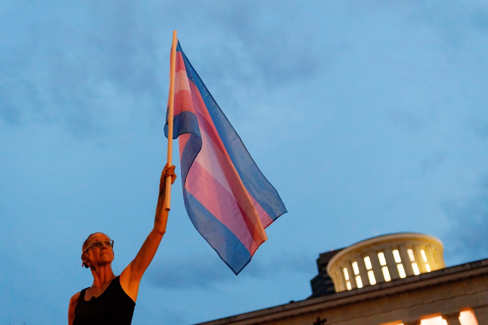 A transgender rights advocate outside of the statehouse to oppose an amendment to a bill to ban transgender women from participating in high school and college women sports in Columbus, Ohio,