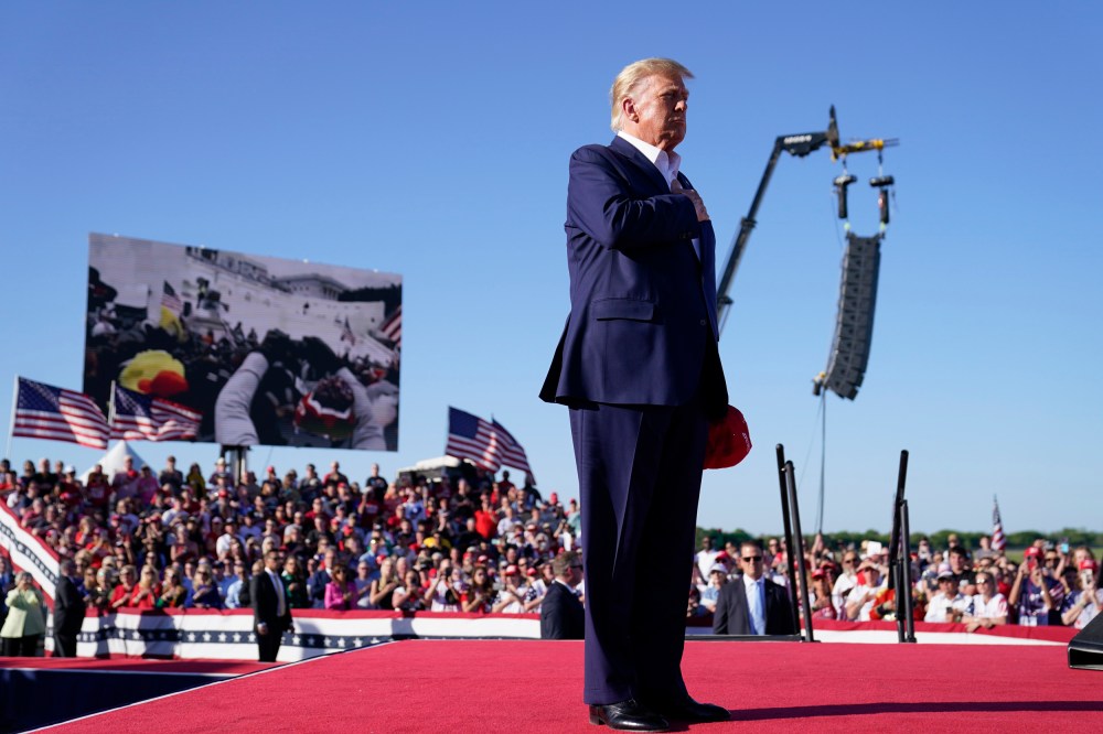 Donald Trump stands while  "Justice for All," is played during a campaign rally, in Waco, Texas