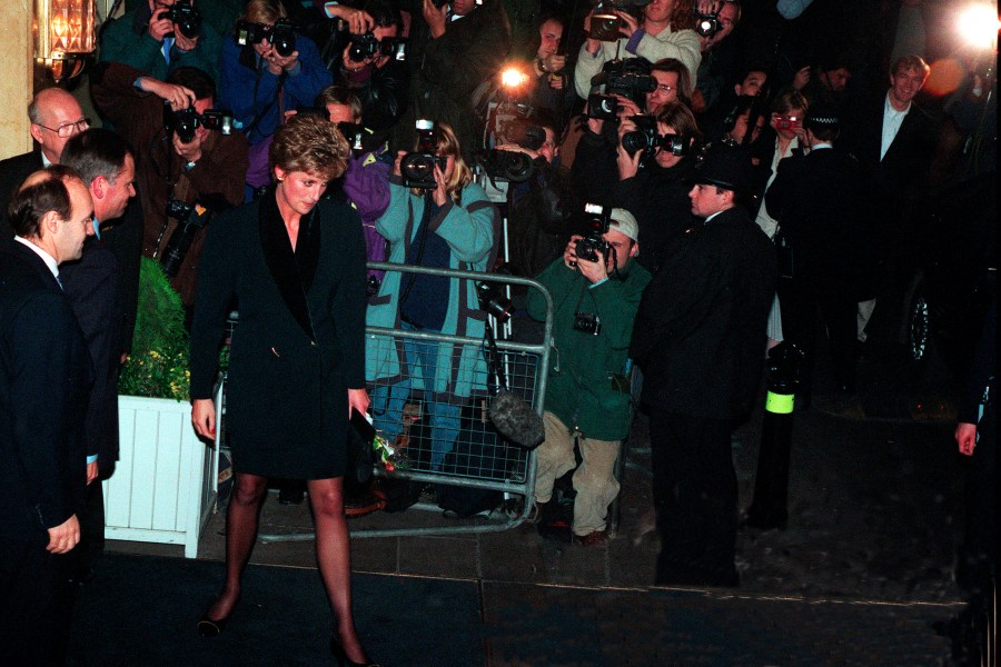 File photo dated 03/12/93 of the Princess of Wales with a wall of photographers after a charity lunch at the Headway National Head Injuries Association where she announced a desire for 'more time and space' to consider the future. In the first episode of the Netflix documentary 